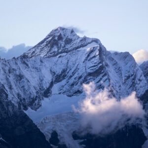 A view of a snowy mountain range from a plane